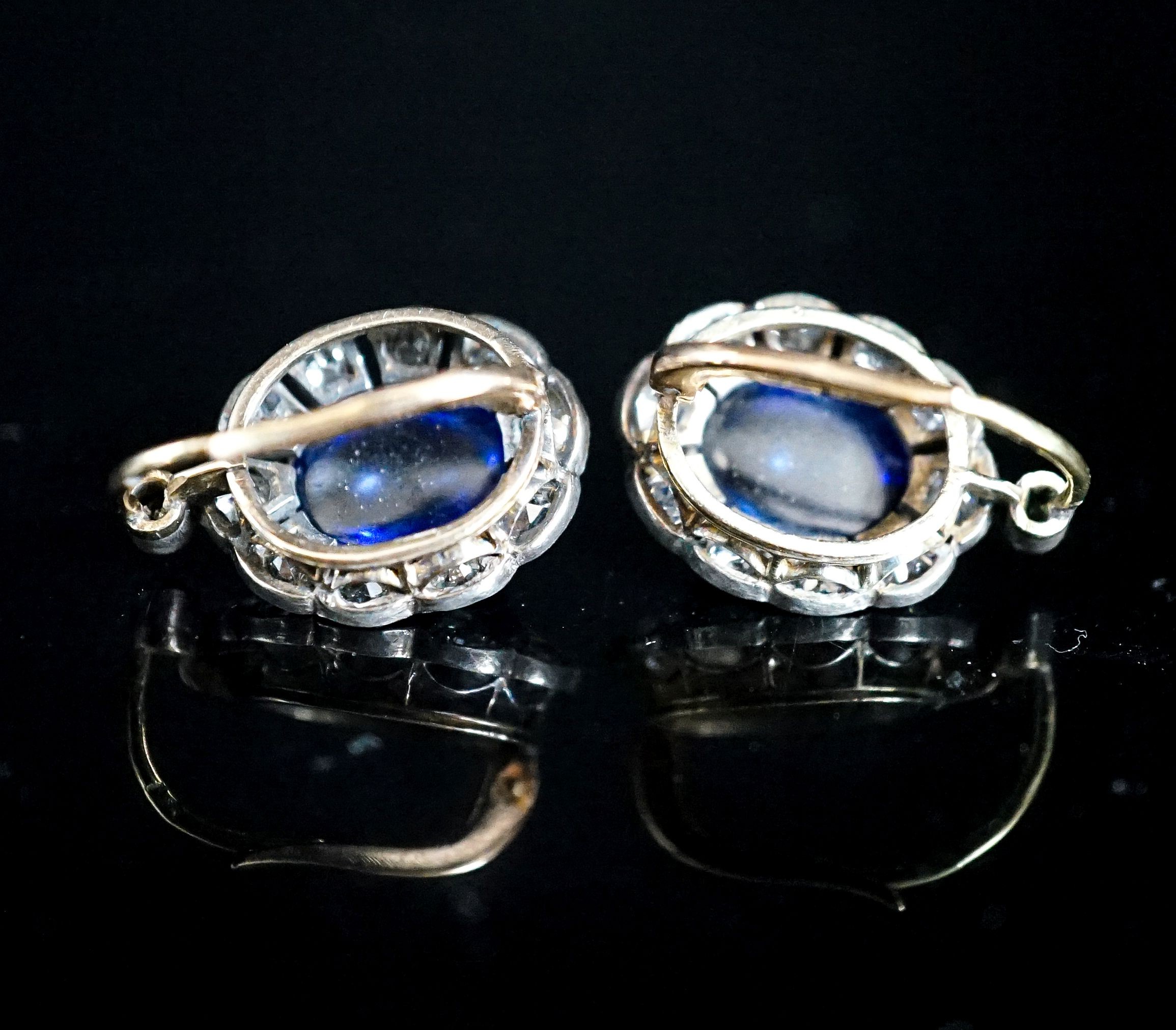 A pair of 19th century gold and silver, cabochon sapphire? and diamond set oval cluster earrings, set with old mine cut diamonds, 20mm, gross 6.9 grams.